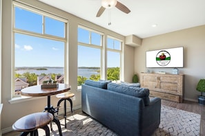 Living Room with Sunroom and Balcony Access-full size Murphy bed style pull out futon under TV.