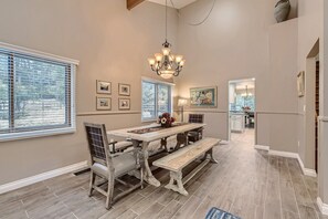 Enjoy a meal under the rustic chandelier at a table with plenty of space for 8.