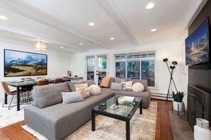 Spacious living room with wood burning fireplace