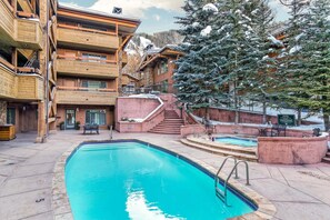Heated pool and hot tub located outside bedroom 2 door