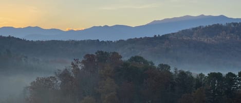 Cabin view of the Great Smoky Mountains with morning mist