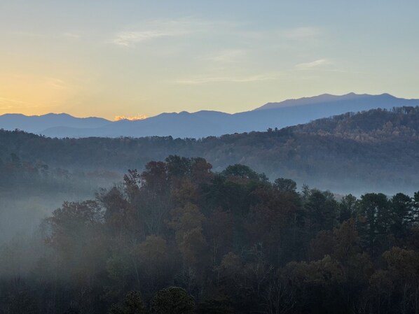 Cabin view of the Great Smoky Mountains with morning mist