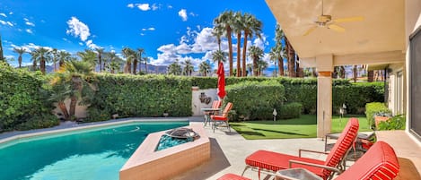 View from kitchen and master bedroom of pool, putting green and mountains.
