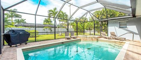 Private Heated Pool and Spa with propane grill and four lounge chairs