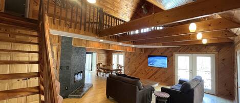 The Great room features 30 ft, vaulted ceilings and views of the whole cabin