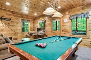 Pool table, mini fridge, Roku TV, and full bathroom downstairs.