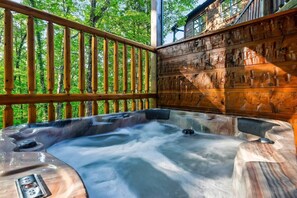 NEW hot tub on the lower level deck!  Enjoy the privacy and beautiful wooded view.