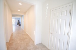 Hall Behind Front Door. Junior Master Bedroom on the Left. Closet on the Right.