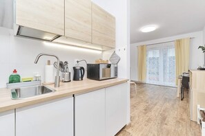 The fully equipped kitchenette includes everything you need for a home-cooked meal.