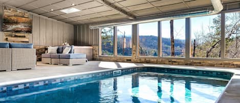 Large 20x12 heated Pool with large hot tub, seating and 65" TV with a beautiful view