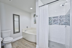 Separate shower and tub in the master bathroom.