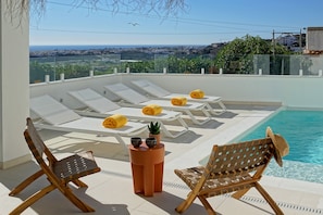The views from dinning room-direct access to pool & sun loungers 