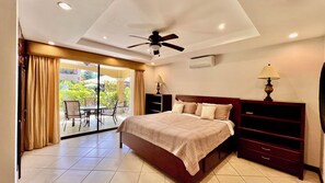 Master bedroom with king bed,  access to patio terrace and private bathroom