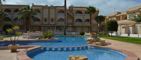 Apartment overlooks communal pool