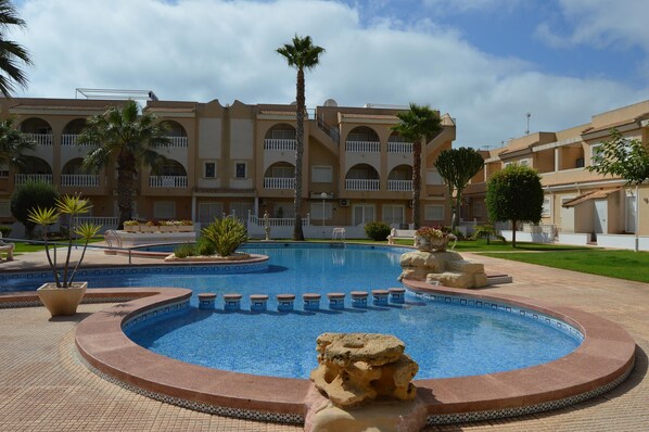 Apartment overlooks communal pool