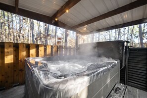 Privacy screen for hot tub enjoyment and patio lights above