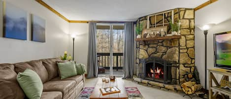 Cozy living room and wood-burning fireplace.