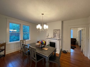 Dining room seats 6 - 7 with 4 chairs and one bench