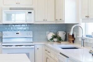Recently updated kitchen with new backsplash and countertops