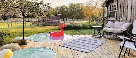 Cowboy pools with lots of deck space with the larger pool heated in the cold.