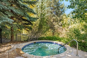 Soak Sore Muscles After a Long Day of Hiking or Skiing in this Year-Round Creekside Hot Tub!