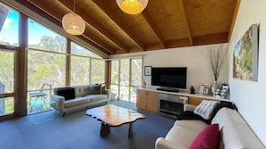 Lounge room with views overlooking snow gums and the toboggan area