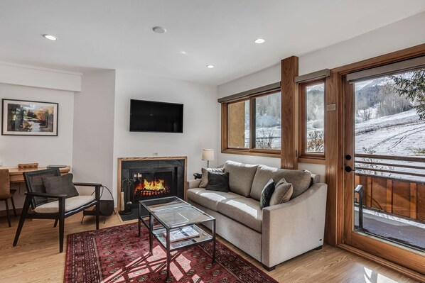 Living room with wood-burning fireplace