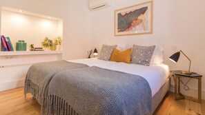 This bedroom offers a lovely view of the small backyard at the back. The backyard has several citrus fruits and it's quite lush! #bedroom #apartment #airbnb #airbnblisbon #portugal #pt #lisbon