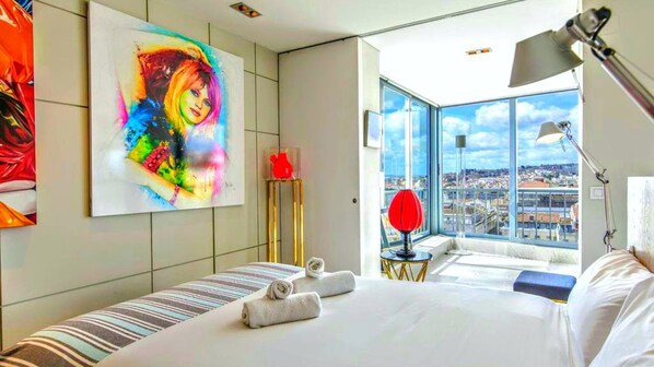 Wonderful bed in an environment surrounded by unique art pieces and a stunning view #art #decor #details #view