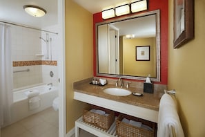 Bathroom with shower and tub. Basic toiletries and towels are provided
