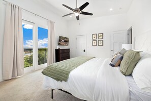 Primary suite with a King size bed, full private bathroom with large shower & tub, closet, and Smart TV.