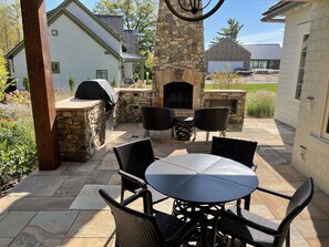 Outdoor grill and wood fireplace