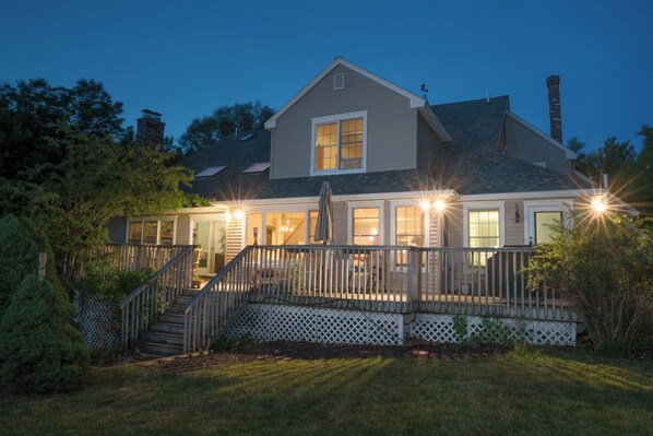 Beautiful home in Bar Harbor has large back deck --  perfect for vacation gathering spot.