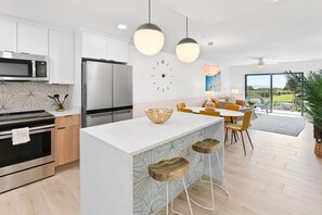 Stylish open-concept living and dining area with a modern retro vibe.