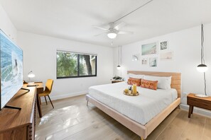 Master bedroom with a king bed and big screen Smart TV.