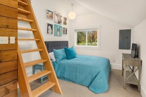 Bedroom 2 has a full bed, tv with apple box.  Ladder leads to the loft. 