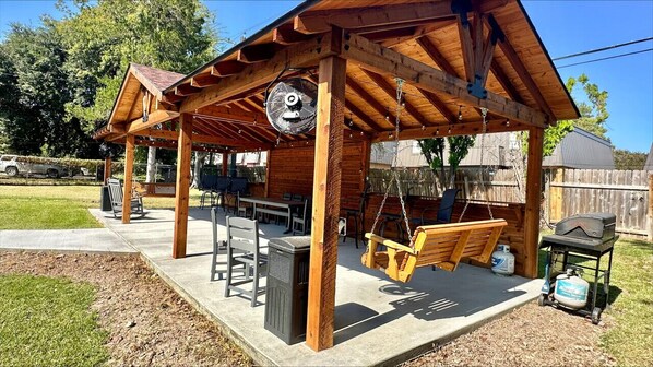 New Gazebo with fans, swings, chairs, table, and grill!