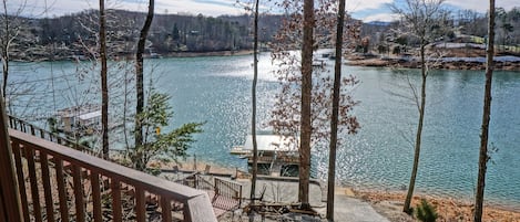 View from lower deck overlooking Boathouse. Afternoon sun off the lake.