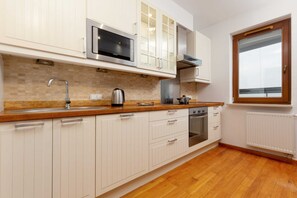 The fully equipped kitchenette includes everything you need for a home-cooked meal.