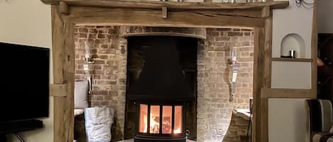 huge inglenook fireplace with wood burning stove, note: dog is not included !