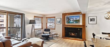 Spacious living room with view of the ski slopes. Open concept floorplan.