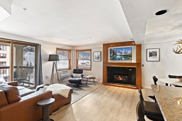 Spacious living room with view of the ski slopes. Open concept floorplan.