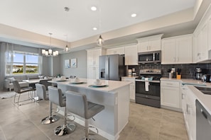 Fully-equipped kitchen with a breakfast bar