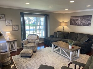 Main floor living room with large picture window