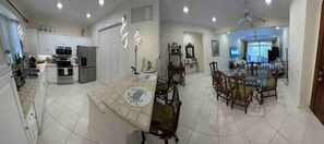 Kitchen, dining table, living room (view from entrance)