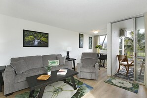 Living Room - Comfy, refreshed living room, dining area, and small lanai with gorgeous views of the Ko'olau mountains and Ala Wai Golf Course