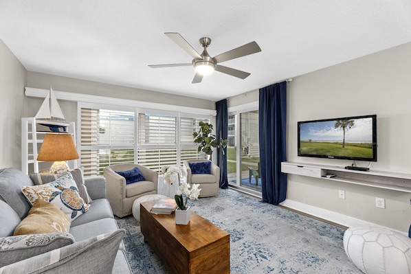 Living Room with Floor-to-Ceiling Windows - You'll love the view from Tradewinds 101.