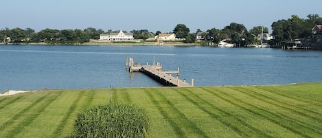 View from back deck looking onto the private dock and creek