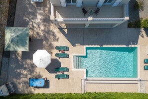 Refreshing aerial views of property and pool