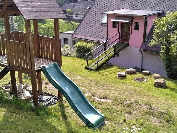 Plant, Property, Building, Wood, House, Land Lot, Tree, Outdoor Furniture, Biome, Cottage